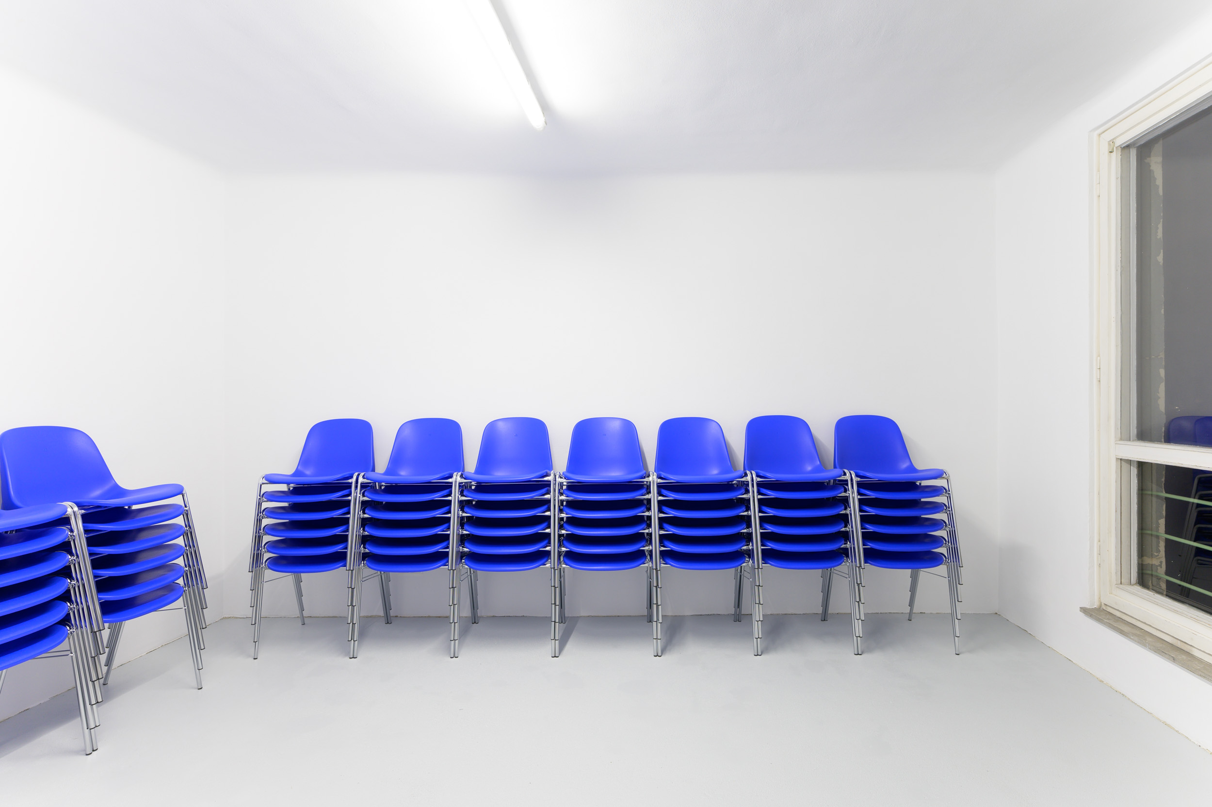 I thought I wanted to be there, but I wasn't sure (Chairs), 2021, 72 chairs, each individually marked, dimensions variable